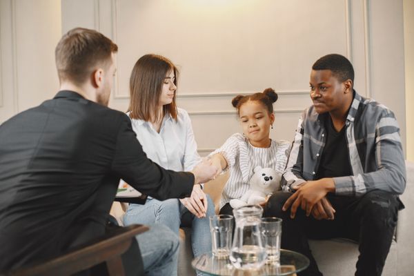A family meeting with a counselor during a family therapy session